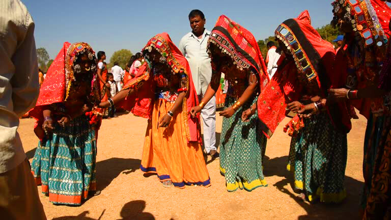 Lambadi Dance group in bright traditional costumes performing with expressive movement and festive energy